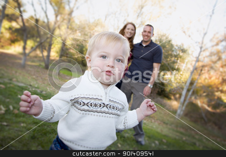 To use this stock image in your creative project, please select the size you need over to the right and click the "Add to Cart" button.
Your downloaded image will come with the Cutcaster watermark removed so don’t worry about the watermark you see on this page. Cute Young Boy Walking as Parents Look On From Behind stock photo, Cute Young Boy Walking in the park as Parents Look On From Behind. by Andy Dean