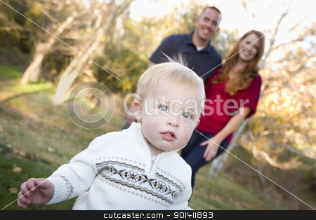 To use this stock image in your creative project, please select the size you need over to the right and click the "Add to Cart" button.
Your downloaded image will come with the Cutcaster watermark removed so don’t worry about the watermark you see on this page. Cute Young Boy Walking as Parents Look On From Behind stock photo, Cute Young Boy Walking in the park as Adoring Parents Look On From Behind. by Andy Dean