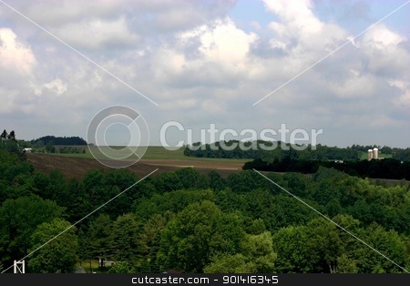 To use this stock image in your creative project, please select the size you need over to the right and click the "Add to Cart" button.
Your downloaded image will come with the Cutcaster watermark removed so don’t worry about the watermark you see on this page. Farm land stock photo, Extended view of Eastern Township farm land by Denis Brien