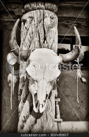 To use this stock image in your creative project, please select the size you need over to the right and click the "Add to Cart" button.
Your downloaded image will come with the Cutcaster watermark removed so don’t worry about the watermark you see on this page. Cow skull stock photo, Cow skull hanging on post at Taos Pueblo in New Mexico by Bryan Mullennix