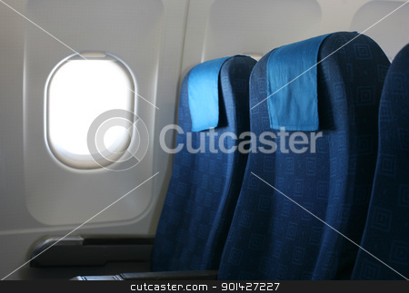 To use this stock image in your creative project, please select the size you need over to the right and click the "Add to Cart" button.
Your downloaded image will come with the Cutcaster watermark removed so don’t worry about the watermark you see on this page. airplane seat and window stock photo, Airplane seat and window inside an aircraft by Paul Prescott