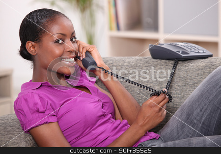 To use this stock image in your creative project, please select the size you need over to the right and click the "Add to Cart" button.
Your downloaded image will come with the Cutcaster watermark removed so don’t worry about the watermark you see on this page. Teenage girl at home on the telephone stock photo, Teenage girl at home on the telephone by photography33
