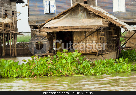 To use this stock image in your creative project, please select the size you need over to the right and click the "Add to Cart" button.
Your downloaded image will come with the Cutcaster watermark removed so don’t worry about the watermark you see on this page. Fisherman Boat House stock photo, Traditional rural fisherman boat house on Tonle Sap Lake in Cambodia, Kompong Khleang village. by Rognar
