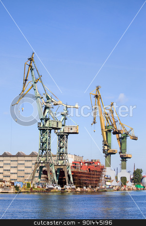 To use this stock image in your creative project, please select the size you need over to the right and click the "Add to Cart" button.
Your downloaded image will come with the Cutcaster watermark removed so don’t worry about the watermark you see on this page. Shipyard Industrial Scenery stock photo, Industrial scenery, huge shipyard cranes and ship under construction by Rognar