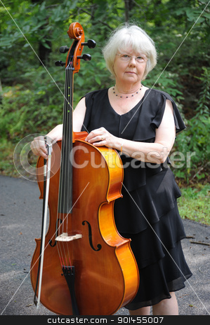 To use this stock image in your creative project, please select the size you need over to the right and click the "Add to Cart" button.
Your downloaded image will come with the Cutcaster watermark removed so don’t worry about the watermark you see on this page. Female cellist. stock photo, Female cellist standing with her cello. by OSCAR Williams