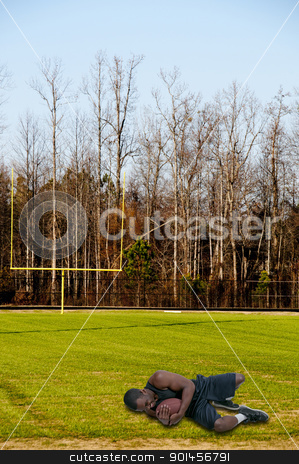 To use this stock image in your creative project, please select the size you need over to the right and click the "Add to Cart" button.
Your downloaded image will come with the Cutcaster watermark removed so don’t worry about the watermark you see on this page. Black Man Playing Football stock photo, Black African American man playing a game of football by Robert Byron