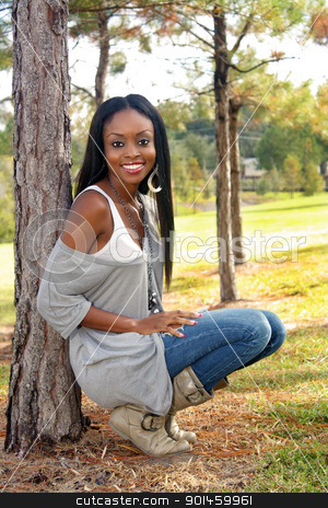 To use this stock image in your creative project, please select the size you need over to the right and click the "Add to Cart" button.
Your downloaded image will come with the Cutcaster watermark removed so don’t worry about the watermark you see on this page. Beautiful Young Woman Outdoors (1) stock photo, An extraordinarily beautiful young woman with a bright, warm smile leans against a pine tree outdoors. by Carl Stewart