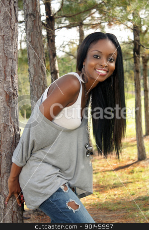 To use this stock image in your creative project, please select the size you need over to the right and click the "Add to Cart" button.
Your downloaded image will come with the Cutcaster watermark removed so don’t worry about the watermark you see on this page. Beautiful Young Woman Outdoors (5) stock photo, An extraordinarily beautiful young woman with a bright, warm smile leans against a pine tree outdoors. by Carl Stewart