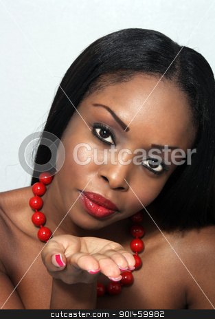 To use this stock image in your creative project, please select the size you need over to the right and click the "Add to Cart" button.
Your downloaded image will come with the Cutcaster watermark removed so don’t worry about the watermark you see on this page. Beautiful Young Woman Blowing a Kiss stock photo, Studio close-up of an extraordinarily beautiful young woman blowing a kiss to the camera. by Carl Stewart