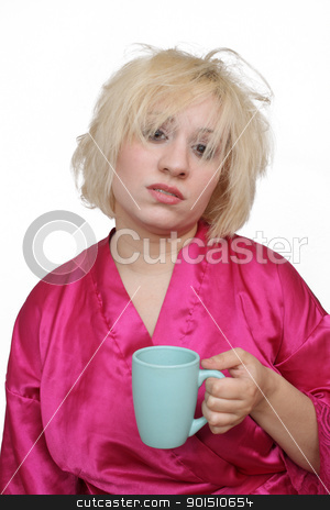 To use this stock image in your creative project, please select the size you need over to the right and click the "Add to Cart" button.
Your downloaded image will come with the Cutcaster watermark removed so don’t worry about the watermark you see on this page. Beautiful Blonde with Coffee (2) stock photo, A lovely young blonde with a captivating smile, wearing a bathrobe and about to take a sip of coffee. by Carl Stewart