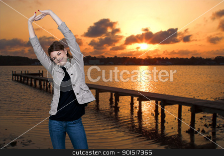 To use this stock image in your creative project, please select the size you need over to the right and click the "Add to Cart" button.
Your downloaded image will come with the Cutcaster watermark removed so don’t worry about the watermark you see on this page. Woman at Sunrise stock photo, Beautiful woman stretching in a morning sunrise at the beach by Robert Byron