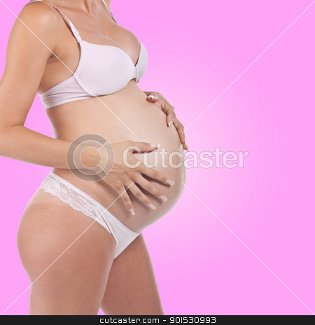To use this stock image in your creative project, please select the size you need over to the right and click the "Add to Cart" button.
Your downloaded image will come with the Cutcaster watermark removed so don’t worry about the watermark you see on this page. Pregnant woman holding tummy stock photo, Future mother - Pregnant woman holding tummy by Adam Radosavljevic