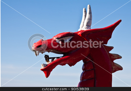 To use this stock image in your creative project, please select the size you need over to the right and click the "Add to Cart" button.
Your downloaded image will come with the Cutcaster watermark removed so don’t worry about the watermark you see on this page. red dragon head stock photo, red dragon head looking in blue sky by burnel11