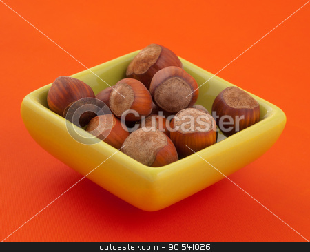 To use this stock image in your creative project, please select the size you need over to the right and click the "Add to Cart" button.
Your downloaded image will come with the Cutcaster watermark removed so don’t worry about the watermark you see on this page. Group of hazelnuts in a bowl. stock photo, Group of hazelnuts in a bowl, with orange background and copy space. by Pablo Caridad