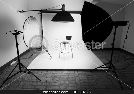 To use this stock image in your creative project, please select the size you need over to the right and click the "Add to Cart" button.
Your downloaded image will come with the Cutcaster watermark removed so don’t worry about the watermark you see on this page. Photo studio stock photo, Photo studio setup with lighting equipment by Tiramisu Studio