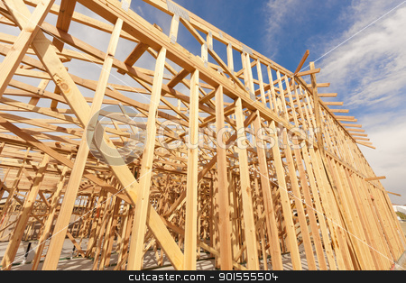 To use this stock image in your creative project, please select the size you need over to the right and click the "Add to Cart" button.
Your downloaded image will come with the Cutcaster watermark removed so don’t worry about the watermark you see on this page. New Construction Home Framing Abstract stock photo, New Construction Wood Home Framing Abstract. by Andy Dean