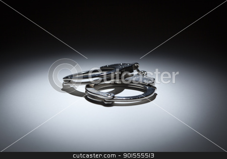 To use this stock image in your creative project, please select the size you need over to the right and click the "Add to Cart" button.
Your downloaded image will come with the Cutcaster watermark removed so don’t worry about the watermark you see on this page. Abstract Pair of Handcuffs Under Spot Light stock photo, Abstract Pair of Handcuffs Under Spot Light on Gradated Background. by Andy Dean