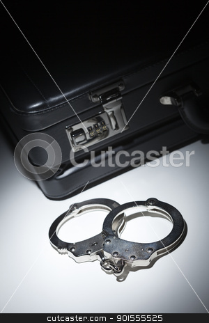 To use this stock image in your creative project, please select the size you need over to the right and click the "Add to Cart" button.
Your downloaded image will come with the Cutcaster watermark removed so don’t worry about the watermark you see on this page. Pair of Handcuffs and Briefcase Under Spot Light stock photo, Pair of Handcuffs and Briefcase Under Spot Light Abstract. by Andy Dean