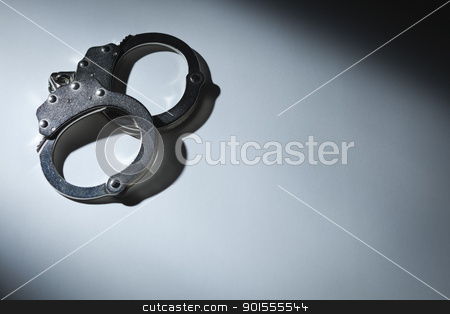 To use this stock image in your creative project, please select the size you need over to the right and click the "Add to Cart" button.
Your downloaded image will come with the Cutcaster watermark removed so don’t worry about the watermark you see on this page. Abstract Pair of Handcuffs Under Spot Light - Text Room stock photo, Abstract Pair of Handcuffs Under Spot Light With Room For Your Own Text. by Andy Dean