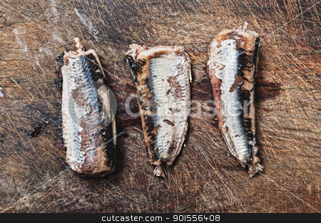 To use this stock image in your creative project, please select the size you need over to the right and click the "Add to Cart" button.
Your downloaded image will come with the Cutcaster watermark removed so don’t worry about the watermark you see on this page. Fresh sardines on wooden background. stock photo, Three fresh sardines on wooden table. by Pablo Caridad