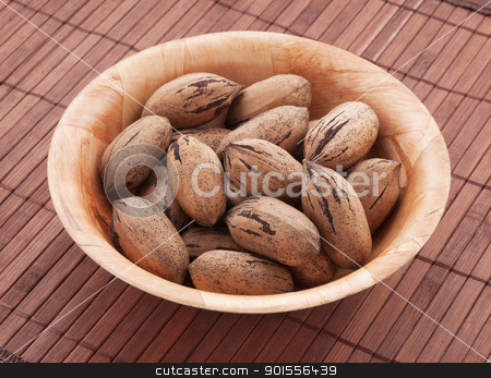 To use this stock image in your creative project, please select the size you need over to the right and click the "Add to Cart" button.
Your downloaded image will come with the Cutcaster watermark removed so don’t worry about the watermark you see on this page. Pecan nuts. stock photo, Bowl of pecan nuts, close up shot. by Pablo Caridad