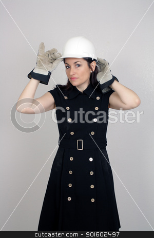 To use this stock image in your creative project, please select the size you need over to the right and click the "Add to Cart" button.
Your downloaded image will come with the Cutcaster watermark removed so don’t worry about the watermark you see on this page. Beautiful Female Construction Worker (5) stock photo, A lovely brunette wearing a white hardhat, work gloves, and a snappy dress, isolated on a textured grey background with generous copyspace. by Carl Stewart