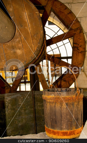 To use this stock image in your creative project, please select the size you need over to the right and click the "Add to Cart" button.
Your downloaded image will come with the Cutcaster watermark removed so don’t worry about the watermark you see on this page. Old wooden well and bucket stock photo, Old wooden and bucket with rusty rings by Iryna Rasko
