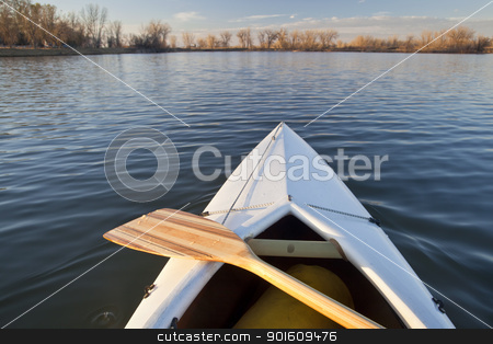 To use this stock image in your creative project, please select the size you need over to the right and click the "Add to Cart" button.
Your downloaded image will come with the Cutcaster watermark removed so don’t worry about the watermark you see on this page. canoe bow and paddle stock photo, bow of white canoe with wooden paddle on a calm lake in Colorado by Marek Uliasz