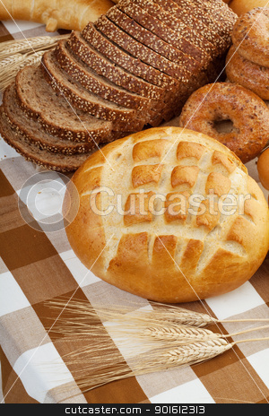 To use this stock image in your creative project, please select the size you need over to the right and click the "Add to Cart" button.
Your downloaded image will come with the Cutcaster watermark removed so don’t worry about the watermark you see on this page. fresh baked bread stock photo, Assortment of baked bread on a table cloth by Steve Mcsweeny