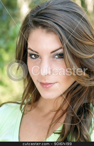 To use this stock image in your creative project, please select the size you need over to the right and click the "Add to Cart" button.
Your downloaded image will come with the Cutcaster watermark removed so don’t worry about the watermark you see on this page. Beautiful Young Brunette, Outdoor Headshot (5) stock photo, A close-up of a lovely young brunette with a warm, friendly smile, outdoors. by Carl Stewart