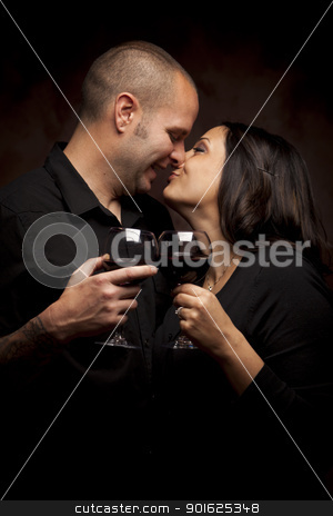 To use this stock image in your creative project, please select the size you need over to the right and click the "Add to Cart" button.
Your downloaded image will come with the Cutcaster watermark removed so don’t worry about the watermark you see on this page. Happy Mixed Race Couple Holding Wine Glasses stock photo, Happy Young Mixed Race Couple Holding Wine Glasses Against A Black Background. by Andy Dean