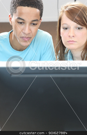 To use this stock image in your creative project, please select the size you need over to the right and click the "Add to Cart" button.
Your downloaded image will come with the Cutcaster watermark removed so don’t worry about the watermark you see on this page. Two teenagers in front of computer stock photo, Two teenagers in front of computer by photography33