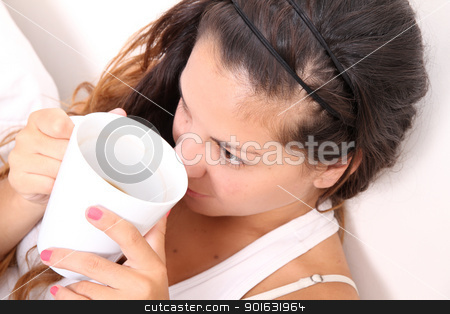 To use this stock image in your creative project, please select the size you need over to the right and click the "Add to Cart" button.
Your downloaded image will come with the Cutcaster watermark removed so don’t worry about the watermark you see on this page. A young Girl drinking Coffee stock photo, A young Girl drinking coffee. by Michael Osterrieder