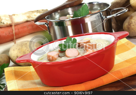 To use this stock image in your creative project, please select the size you need over to the right and click the "Add to Cart" button.
Your downloaded image will come with the Cutcaster watermark removed so don’t worry about the watermark you see on this page. Potato soup stock photo, Potato soup with Wiener sausage, greens and parsley by Maren Wischnewski