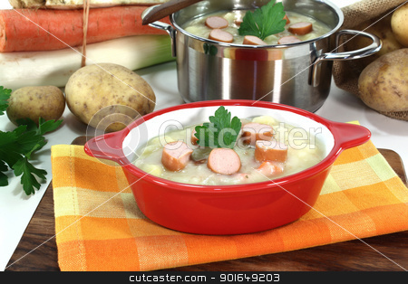 To use this stock image in your creative project, please select the size you need over to the right and click the "Add to Cart" button.
Your downloaded image will come with the Cutcaster watermark removed so don’t worry about the watermark you see on this page. Potato soup stock photo, Potato soup with Wiener sausage, greens and parsley by Maren Wischnewski