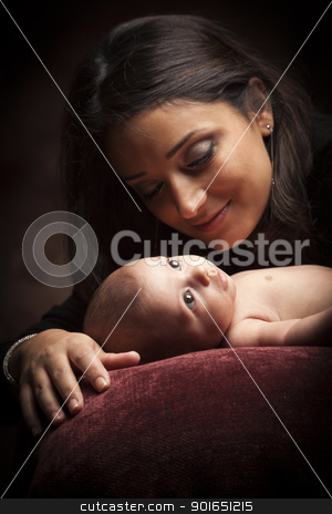 To use this stock image in your creative project, please select the size you need over to the right and click the "Add to Cart" button.
Your downloaded image will come with the Cutcaster watermark removed so don’t worry about the watermark you see on this page. Attractive Ethnic Woman with Her Newborn Baby stock photo, Young Attractive Ethnic Woman Holding Her Newborn Baby Under Dramatic Lighting. by Andy Dean