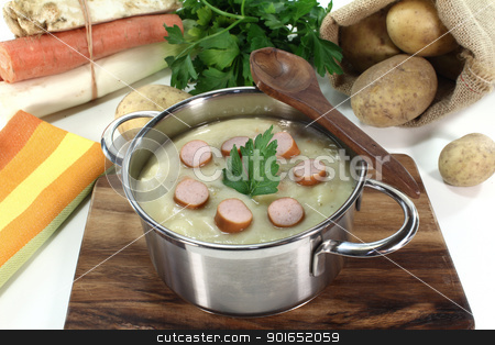 To use this stock image in your creative project, please select the size you need over to the right and click the "Add to Cart" button.
Your downloaded image will come with the Cutcaster watermark removed so don’t worry about the watermark you see on this page. Potato soup stock photo, Potato soup with Wiener sausage, greens and parsley by Maren Wischnewski