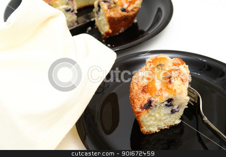 To use this stock image in your creative project, please select the size you need over to the right and click the "Add to Cart" button.
Your downloaded image will come with the Cutcaster watermark removed so don’t worry about the watermark you see on this page. Blueberry Ring Cake stock photo, Slice of fresh baked Blueberry Ring Cake served on a black plate with a light colored background by Lynn Bendickson