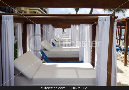 To use this stock image in your creative project, please select the size you need over to the right and click the "Add to Cart" button.
Your downloaded image will come with the Cutcaster watermark removed so don’t worry about the watermark you see on this page. Luxury Daybed stock photo, A luxury day bed located on the beach by Kevin Tietz