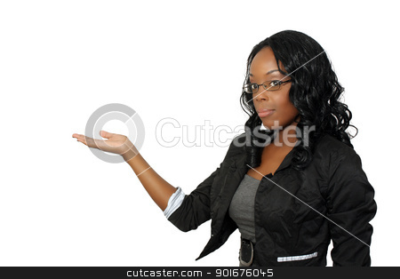 To use this stock image in your creative project, please select the size you need over to the right and click the "Add to Cart" button.
Your downloaded image will come with the Cutcaster watermark removed so don’t worry about the watermark you see on this page. Beautiful Hostess, Closeup (4) stock photo, A close-up of a lovely young black hostess, pointing toward frame left. Place your graphic easily into her flat palm. Isolated on a white background with generous copyspace. by Carl Stewart