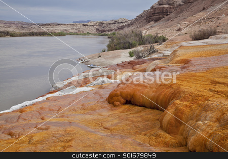 To use this stock image in your creative project, please select the size you need over to the right and click the "Add to Cart" button.
Your downloaded image will come with the Cutcaster watermark removed so don’t worry about the watermark you see on this page. Green River at Crystal Geyser stock photo, Green River at Crystal Geyser below town of Green River, Utah - a shore covered with orange mineral deposits, two kayaks by Marek Uliasz