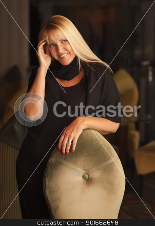 To use this stock image in your creative project, please select the size you need over to the right and click the "Add to Cart" button.
Your downloaded image will come with the Cutcaster watermark removed so don’t worry about the watermark you see on this page. Beautiful Blonde Woman Standing Near Chair stock photo, Sensual Beautiful Blonde Woman Standing Near Chair. by Andy Dean