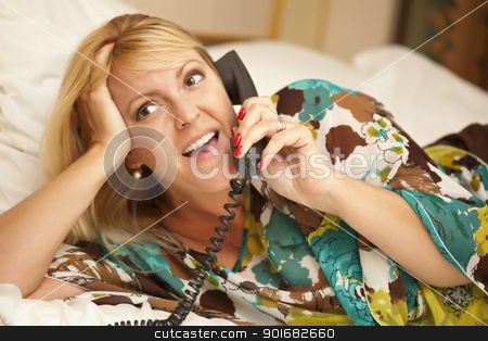 To use this stock image in your creative project, please select the size you need over to the right and click the "Add to Cart" button.
Your downloaded image will come with the Cutcaster watermark removed so don’t worry about the watermark you see on this page. Woman Laying on Her Bed Using the Telephone stock photo, Beautiful Blonde Woman Laying on Her Bed Using the Telephone. by Andy Dean