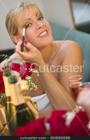 To use this stock image in your creative project, please select the size you need over to the right and click the "Add to Cart" button.
Your downloaded image will come with the Cutcaster watermark removed so don’t worry about the watermark you see on this page. Blonde Woman Applies Makeup at Mirror Near Champagne and Roses stock photo, Attractive Blonde Woman Applies Her Makeup at a Mirror Near Champagne and Roses. by Andy Dean