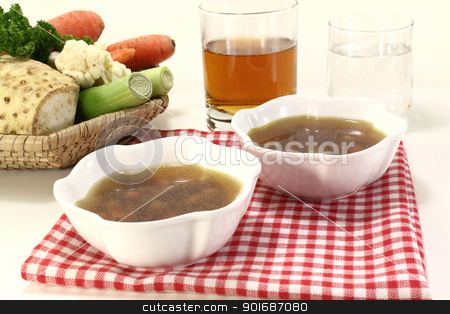 To use this stock image in your creative project, please select the size you need over to the right and click the "Add to Cart" button.
Your downloaded image will come with the Cutcaster watermark removed so don’t worry about the watermark you see on this page. Beef consomme stock photo, Beef consomme with root vegetables with a glass of juice and water by Maren Wischnewski