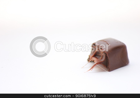 To use this stock image in your creative project, please select the size you need over to the right and click the "Add to Cart" button.
Your downloaded image will come with the Cutcaster watermark removed so don’t worry about the watermark you see on this page. Bite taken out of candy stock photo, A bite taken out of a piece of chocolate candy with caramel filling. by Matthew Howard