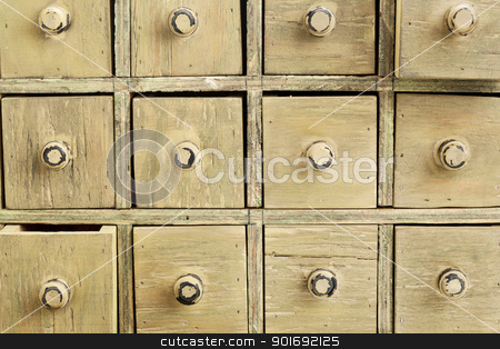 To use this stock image in your creative project, please select the size you need over to the right and click the "Add to Cart" button.
Your downloaded image will come with the Cutcaster watermark removed so don’t worry about the watermark you see on this page. primitive apothecary drawer cabinet stock photo, drawers of primitive vintage grunge wood apothecary cabinet by Marek Uliasz
