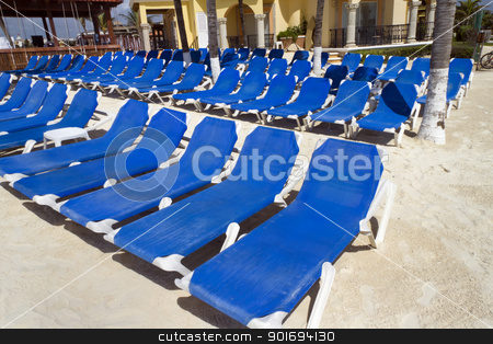 To use this stock image in your creative project, please select the size you need over to the right and click the "Add to Cart" button.
Your downloaded image will come with the Cutcaster watermark removed so don’t worry about the watermark you see on this page. Rows of Blue Chairs stock photo, Rows of blue several lounge chairs on the beach by Kevin Tietz