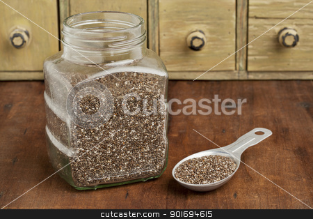 To use this stock image in your creative project, please select the size you need over to the right and click the "Add to Cart" button.
Your downloaded image will come with the Cutcaster watermark removed so don’t worry about the watermark you see on this page. jar and tablespoon of chia seeds stock photo, chia seeds in glass jar and on measuring aluminum tablespoon with a vintage drawer cabinet in background by Marek Uliasz