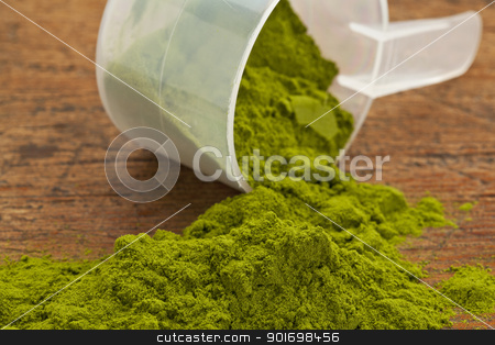 To use this stock image in your creative project, please select the size you need over to the right and click the "Add to Cart" button.
Your downloaded image will come with the Cutcaster watermark removed so don’t worry about the watermark you see on this page. wheatgrass powder supplement stock photo, wheatgrass powder spilling of a plastic measuring scoop against grunge wood background by Marek Uliasz